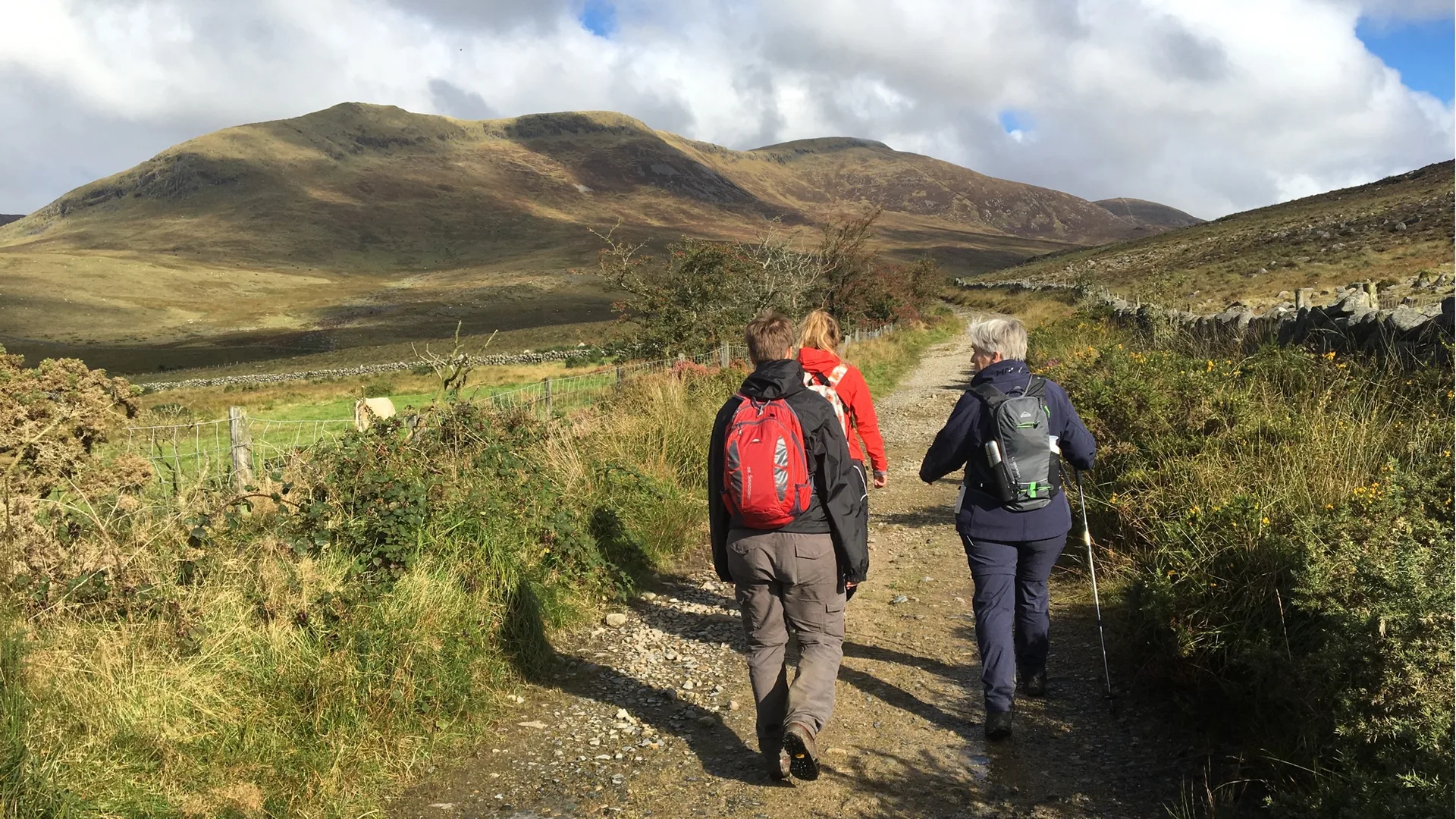 Hikers enjoying mountain views in the Mourne Mountains