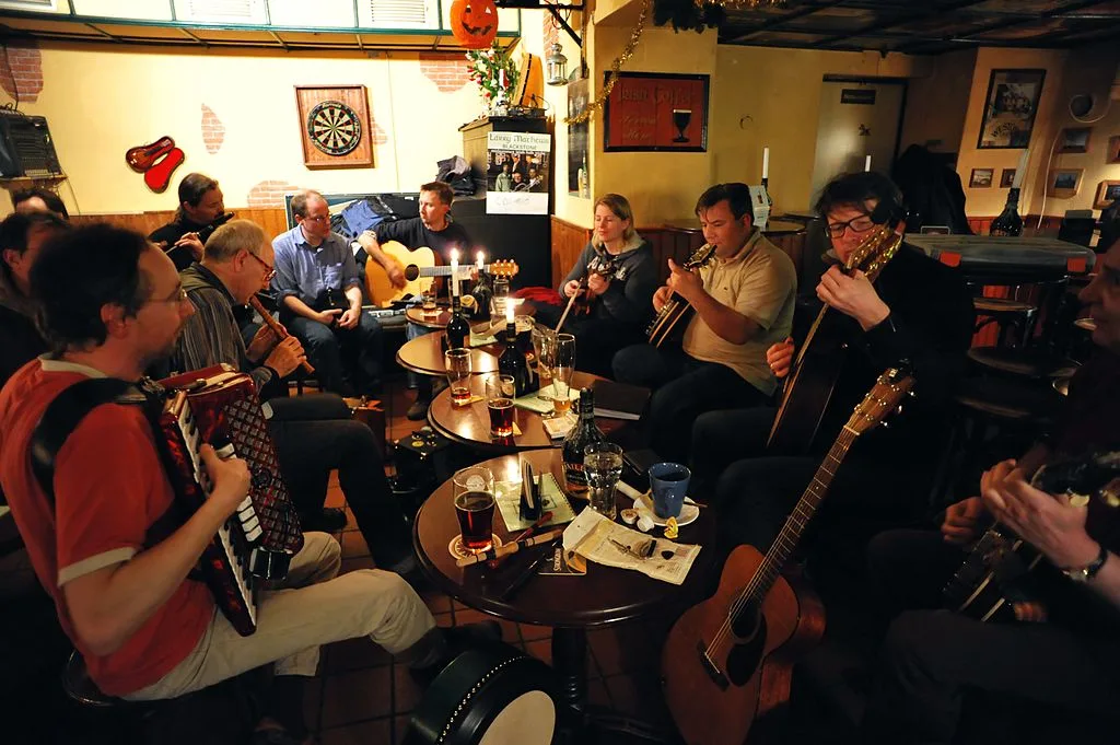 Musicians performing traditional Irish folk session in an atmospheric Dublin pub, capturing the cultural heart of the city's bar scene