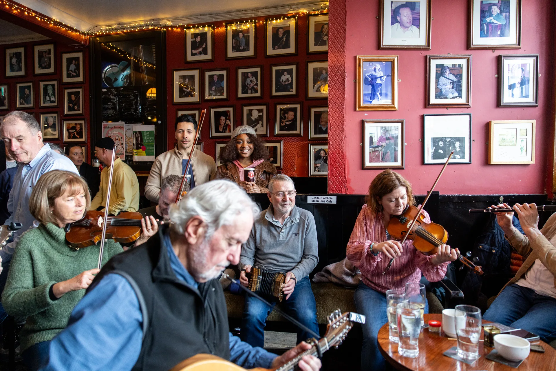 Dublin city walking tour group enjoying drinks and conversation on a Dublin street, showing the guided walking experience through the city