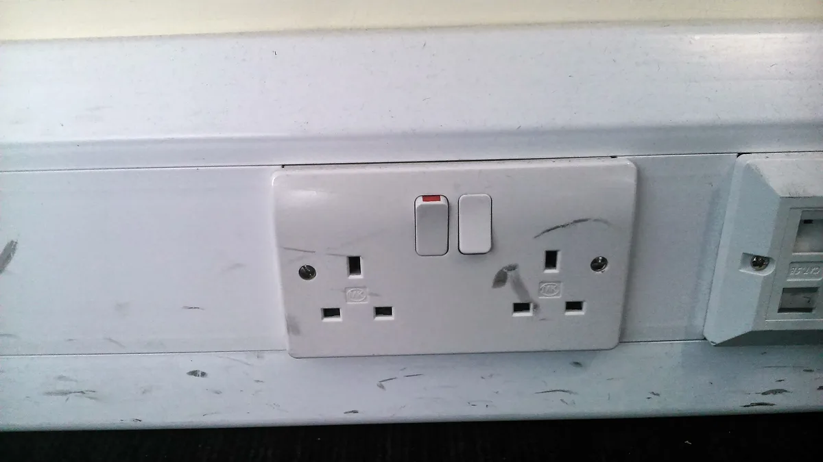Type G double wall socket with switches, the outlet your power adapter for Ireland plugs into