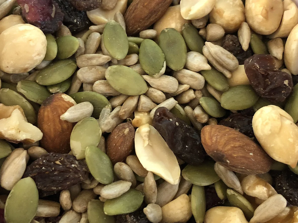 Close-up of trail mix with nuts, seeds and dried fruit, one of the best hiking snacks for Ireland's trails