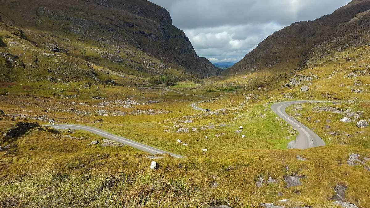 Walkers on the road through the Gap of Dunloe, one of the finest Ring of Kerry walks