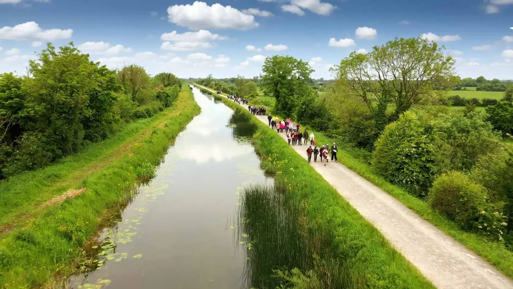 School children joining walkers on the Royal Canal towpath along the National Famine Way