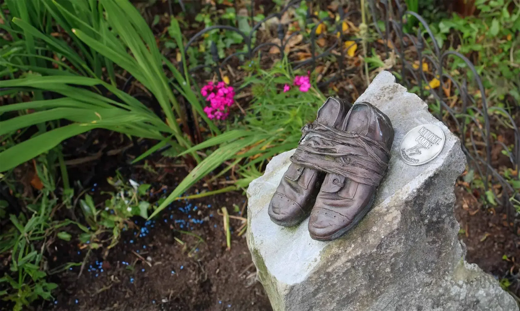 One of the 32 pairs of bronze children's shoes set along the National Famine Way